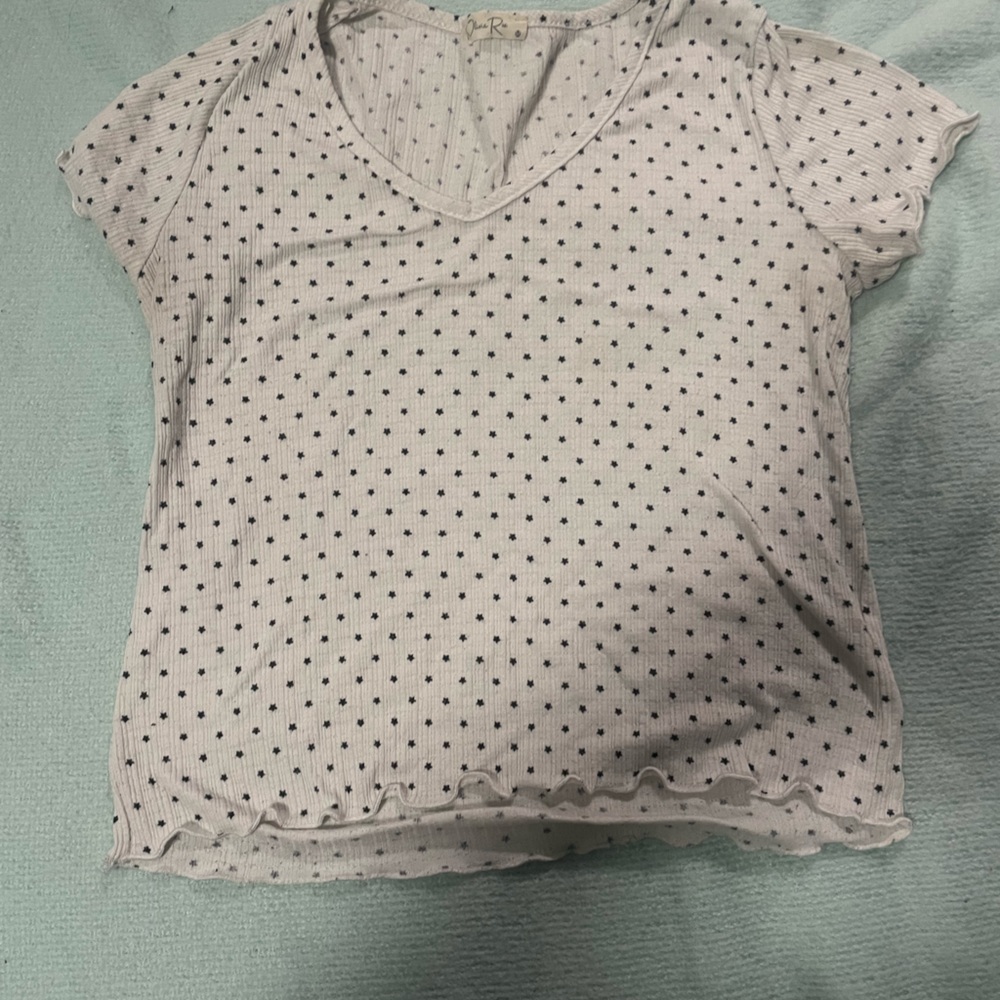 White shirt with black stars size M.